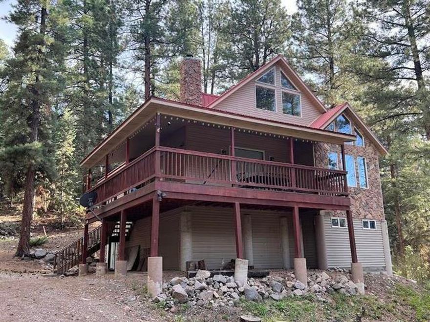 Discover your dream escape in this beautiful 3-bedroom, 3.5-bath cabin nestled on half an acre just around the corner from the lake! Enjoy serene mornings and starry nights from your expansive wrap-around deck, perfect for entertaining or soaking in nature. Inside, you'll find a spacious loft, a cozy den with an attached bath, surround sound system, vaulted ceilings, and upgraded appliances and lighting throughout. Bring all your toys--there's a long storage garage ready for your gear! Whether it's a weekend getaway or retreat away from the heat, this cabin blends comfort, charm, and adventure in one perfect package. Price Per sq. ft is $222.00.
Call for Sellers financing terms.
 A water spigot is installed on the property to assist in minimizing dust on the road.