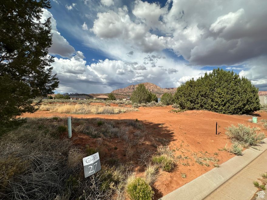 Imagine the possibilities on this expansive .46-acre homesite nestled within the desirable Cedar Point Subdivision of Apple
Valley. Escape the ordinary and embrace the freedom of space, where breathtaking panoramic vistas become your everyday
backdrop. Picture crafting your dream home in this prime location, offering a serene retreat yet keeping you conveniently
connected - just a short 30-minute drive to the vibrant city of St. George and the stunning natural wonders of Zion National Park and Sand Hollow State Park. This is more than just land; it's an invitation to build the life you've always envisioned.