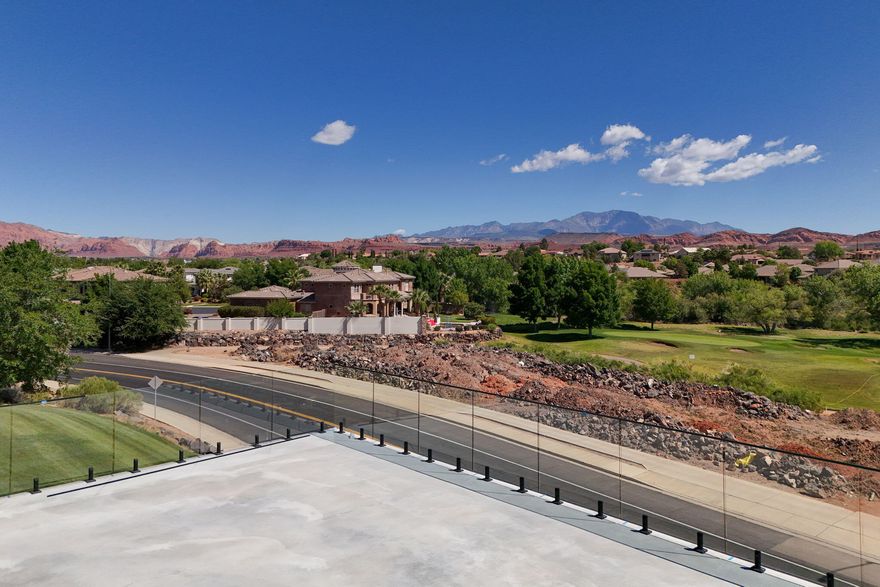 Some condos offer a view. This one offers a perspective. Positioned directly on the Sunbrook Golf Course, this brand new flagship unit represents the absolute pinnacle of luxury condo living in Saint George -- a city that has quietly become one of the most coveted destinations in the American Southwest. With unobstructed, panoramic views of Snow Canyon State Park and the Pine Valley Mountains stretching endlessly before you, this is not simply a place to stay. It is a permanent front-row seat to one of nature's greatest shows.

Step inside and the level of craftsmanship is immediately unmistakable. The expanded floor plan flows with an ease and generosity rarely found in condo living -- every surface, every fixture, every detail selected with intention. The gourmet kitchen is a chef's dream: premium appliances, designer cabinetry, and the kind of counter space that makes entertaining feel effortless. Three full bathrooms ensure every guest experiences the same luxury standard, while the primary suite is a sanctuary unto itself -- a spa-inspired bath that transforms your morning routine into a ritual.

'Step out onto your massive private patio, pour a drink, and watch the sun set fire to Snow Canyon's red rock cliffs. There is no finer seat in Saint George -- and it's yours every night.'
But the true showpiece of this unit is the massive private patio. Overlooking the Sunbrook fairways with Snow Canyon and Pine Valley as your uninterrupted backdrop, this outdoor living space is an entertainer's paradise -- complete with an outdoor kitchen that makes al fresco dining the only sensible choice every evening. Whether you're hosting a sunset gathering or sitting in quiet solitude with your morning coffee as the canyon glows at dawn, this patio will become the heart of your life here.