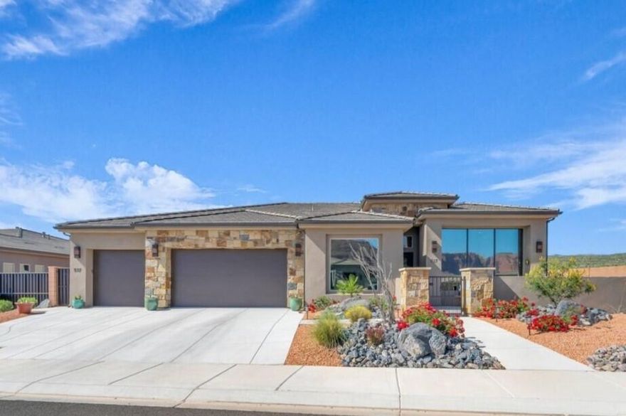 Nestled within a quiet, well-kept neighborhood, this charming home offers a true oasis where every detail has been thoughtfully crafted. From the moment you arrive, the inviting courtyard and low-maintenance landscaping frame stunning red cliff views right from the front of the home. Inside, soaring ceilings and an open concept layout create an expansive, light-filled atmosphere, enhanced by high-end finishes at every turn. Large windows and a 3-panel sliding glass door bring the outdoors in, showcasing the breathtaking scenery and bathing the living spaces in natural light. The chef-inspired kitchen is a culinary enthusiast's dream, while the built-in office cabinetry and luxurious primary suite, with a double vanity and spacious walk-in closet, offer both comfort and practicality. An oversized 3-car garage, plus additional outdoor parking, provides ample space for all the toys, gear, or RV parking, making this home as functional as it is beautiful. Buyer to verify all information, deemed reliable, however buyer to verify all info including utilities, rental restrictions, and HOA information if applicable.