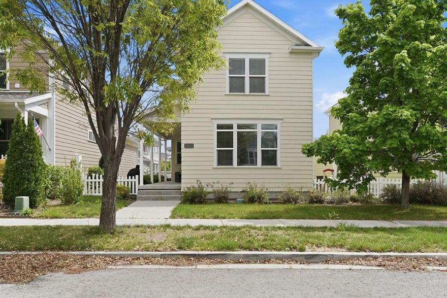 Situated in the highly desirable Daybreak community, this home showcases one of the area's most popular floorplans and a thoughtfully upgraded interior. The main level offers an open-concept design with beautiful bamboo flooring, a bright living space, dining area, half bath, and a well-appointed kitchen featuring quartz countertops, stainless steel appliances, tile backsplash, and abundant natural light. Upstairs includes three spacious bedrooms along with a versatile loft. The primary suite is generously sized with dual walk-in closets and an en-suite bath complete with double sinks, a soaking tub, and separate shower. Enjoy relaxing on the covered front porch, plus the added bonus of a large cold storage room. The home is surrounded by inviting shared green spaces, perfect for outdoor enjoyment, and includes access to Daybreak's exceptional amenities such as pools, parks, trails, fitness center, sports courts, gardens, and more