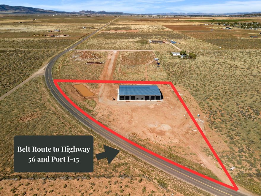 High traffic 4.96 acre commercial lot with 15,000 sq ft climate controlled building located off Hamilton Fort exit in Cedar City. Property has freeway visibility and near a Sinclair gas station. 3850 W also is considered Iron County's belt route and take you directly to Hwy 56 and Port-15 Industrial project. This is the perfect location for a business. 8 inch concrete floors reinforced with rebar and fiber. 12- 16ft tall bay doors. The building is set up like a duplex for 2- 7,500 sq ft sides under one roof making the option to lease out a side a great investment. Each side comes with just under 900 sq ft of office space, bathrooms, and storage. Each side also comes with a 2nd level mezzanine adding close to 800 sq ft of additional office/storage space. Ready in November 2025.