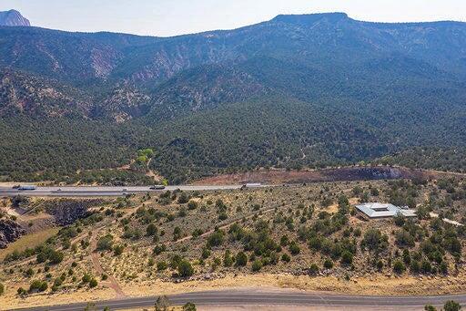 Incredible 5 acre view lot in a unique equestrian community. House plans, have been done and included. All utilities natural gas, electricity, paved roads and an acre share of water in a mutual water company.  Easy access, conveniently located off the I-15 between St George and Cedar City.  Zion National Parks Kolob Canyons to the east.  Come check out this incredible view lot.