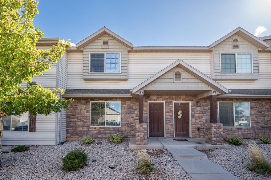 This budget-friendly townhome is well maintained and move-in ready! You're sure to appreciate the great location, comfortable living space, outdoor areas to enjoy, and extra parking. Home #68 faces west with an assigned covered parking stall in front. The fully fenced patio offers afternoon shade and a quiet, private retreat. Enjoy the large grassy common area, playground, pavilion, and ample guest parking. Conveniently located just off Main Street near the hospital and only five minutes from downtown Cedar City and Southern Utah University. The main level includes a cozy living room, ample kitchen area with dining area, a half bath, and laundry room, with three bedrooms and two full baths upstairs, including a large primary suite.