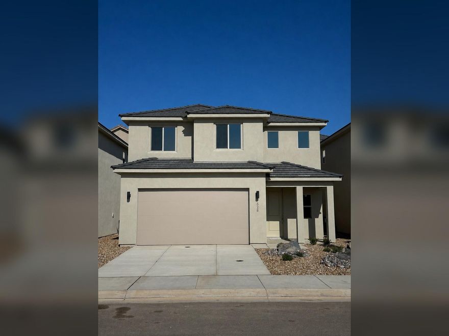 Stunning Ence Home in the sought-after Red Trails community of Washington, UT-located at the end of the Virgin River Bike Trail! Primarily used as a second home with minimal usage, this energy-efficient, move-in ready home features LVP waterproof flooring, upgraded cabinets and finishes, hot water on demand, soft water system, walk-in closet, walk-in laundry room located near bedrooms, a charming reading nook, extra storage, spacious 9' ceilings, a gated backyard, and a covered patio. Built with premium construction including R-49 attic insulation, Low-E windows, climate control for each floor, TechShield radiant barrier, and has 7 years remaining of the base 10-year home warranty. Fully landscaped front and back with low maintenance desert xeriscaping and auto drip irrigation. All-electric with affordable Dixie Power utilities. Step outside in the quiet walkable neighborhood near the Virgin River for gorgeous Red Rock views, and you're only minutes from Sand Hollow and Quail Creek State Parks, the airport, shopping, parks, trails, and the greater St. George/Zion area. Priced below comparable homes-priced to sell fast!