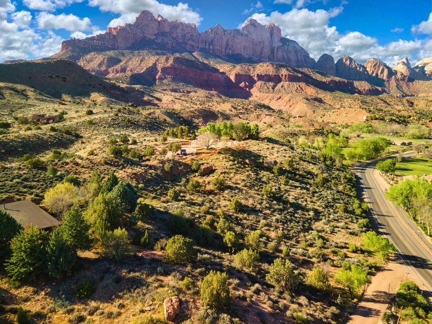 Welcome to a slice of paradise just a stone's throw away from the awe-inspiring Zion National Park! Nestled in the heart of Springdale, Utah, this approximately 2.1-acre gem offers an elevated living experience that's as unique as it is enchanting.
Prepare to be swept off your feet by the sheer magnificence of this extraordinary property. With 360-degree views that could rival even the most picturesque postcards, it's not just a piece of land... it's an invitation to embark on a journey of soul-stirring inspiration.
Picture yourself waking up to the gentle hues of a Utah sunrise, painting the sky with hues of gold and pink. And as the day comes to a close, indulge in the spectacle of the sunset, casting its warm embrace over the rugged terrain of this famous landscape. But it's not just about the views, this haven offers a lifestyle like no other. With hiking, biking, and year-round adventures right at your doorstep, every day is an opportunity for new discoveries and cherished memories. And when it's time to unwind, immerse yourself in the tranquility of native plants, under a canopy of dark night skies that seem to whisper tales of adventure.
Convenience meets seclusion on a private road just a hop, skip, and a jump away from the Zion Canyon Shuttle line. And with utilities readily available on Kinesava Drive, your dream of building a custom retreat is closer than ever.
Whether you're dreaming of a cozy hideaway or a luxurious escape, this property offers vistas that stretch as far as the eye can see overlooking Zion Canyon, the Virgin River Valley, and Parunaweep Canyon. It's more than just a piece of land, it's an opportunity to create your very own sanctuary amidst the majestic landscapes of Utah. Don't let this chance slip through your fingers! House plans and additional reports available for review.