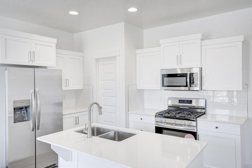 4 bed with the primary bedroom on the main floor, 2.5 bath home with a 2-car garage in the brand-new Paraiso community by Salisbury Homes. Features include EVP flooring in main living areas and bathrooms, upgraded carpet in bedrooms, quartz countertops throughout, stainless steel gas appliances (fridge not included), modern cabinets, and kitchen backsplash. Community park, trails, and amenities nearby. NOTE: Interior and exterior finishes are predetermined and may change. Photos are examples of the finishes are also subject to change. TAKE ADVANTAGE OF A $7,000 LENDER INCENTIVE AND GET A LOWER RATE! Buyer/agent to verify all info.