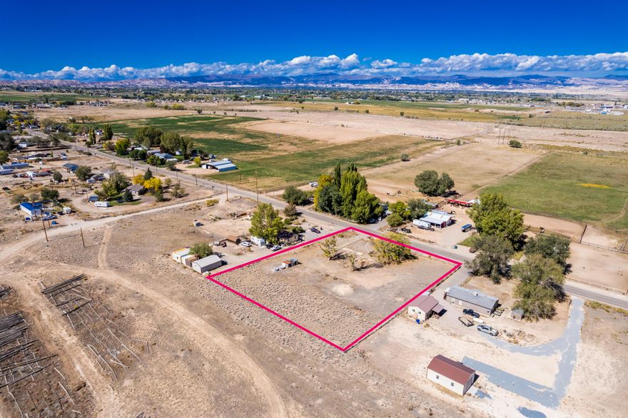 Bring your building plans! This 1.35-acre lot located at 3340 E 5000 S, Vernal is ready for your dream home. The property comes with sewer, water, and power already on the land, making the building process smoother and more affordable. The lot is fully fenced, providing  a clear boundary line.
Nestled in the desirable Davis area, this parcel offers plenty of space for a home, shop, animals, or extra storage, all while enjoying the peace and quiet of country living-just minutes from Vernal amenities.
Don't miss this opportunity to own acreage that's build-ready with utilities in place!
Buyer & Buyers agent to verify all information.