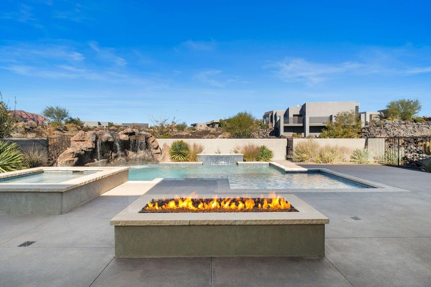 A true Desert Oasis nestled in the highly sought after and prestigious Entrada @ Snow Canyon Country Club.  Situated on an oversized .81 acre lot, this sprawling estate features views of Snow Canyon & Red Mountain.   The resort style backyard features a built in custom swimming pool equipped with a grotto, waterfall, detached Hot Tub, fire pit, and even a Mote! 

The gourmet kitchen features SubZero/Wolf appliances, a 6 burner wolf cooktop, and an open floor plan with floor to ceiling windows.  

The detached Casita (ADU) features its own private entrance, a private garage, and is fully equipped with a kitchenette, full bathroom, plumbed for stack washer / dryer, and a mud room with desk. 

The solar system on the roof is fully paid for and makes for extremely cheap power bills. This home was built by Shakespeare Dev. Group and is fully upgraded.  Each bedroom has an ensuite bathroom with views and plenty of space.  Come check out this gem nestled in the Lava Rocks @ Entrada.