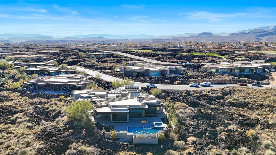 A true Desert Oasis nestled in the highly sought after and prestigious Entrada @ Snow Canyon Country Club.  Situated on an oversized .81 acre lot, this sprawling estate features views of Snow Canyon & Red Mountain.   The resort style backyard features a built in custom swimming pool equipped with a grotto, waterfall, detached Hot Tub, fire pit, and even a Mote! 

The gourmet kitchen features SubZero/Wolf appliances, a 6 burner wolf cooktop, and an open floor plan with floor to ceiling windows.  

The detached Casita (ADU) features its own private entrance, a private garage, and is fully equipped with a kitchenette, full bathroom, plumbed for stack washer / dryer, and a mud room with desk. 

The solar system on the roof is fully paid for and makes for extremely cheap power bills. This home was built by Shakespeare Dev. Group and is fully upgraded.  Each bedroom has an ensuite bathroom with views and plenty of space.  Come check out this gem nestled in the Lava Rocks @ Entrada.