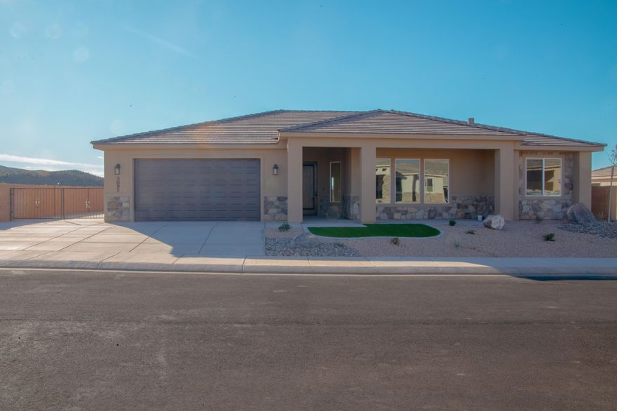 Gemstone Custom Homes - Construction to be finished 12/2/2025. Photos are of a similar home we built last year. No HOA! This home features drought-tolerant professionally landscaped front and backyard with a covered patio. Master suite includes spacious walk-in closet and fully-tiled recessed walk-in shower with glass door. Two car garage is fully drywalled and painted! Quality GE appliances, Moen Plumbing fixtures, quartz countertops, spacious pantry, and classic stained hardwood cabinetry with soft-close hinges and under-cabinet lights. Woodgrain tile floors and gas fireplace in living room. Thirty-foot paved RV pad with full-hookups! (water, 30-amp + sewer dump). Customizable if you act soon.