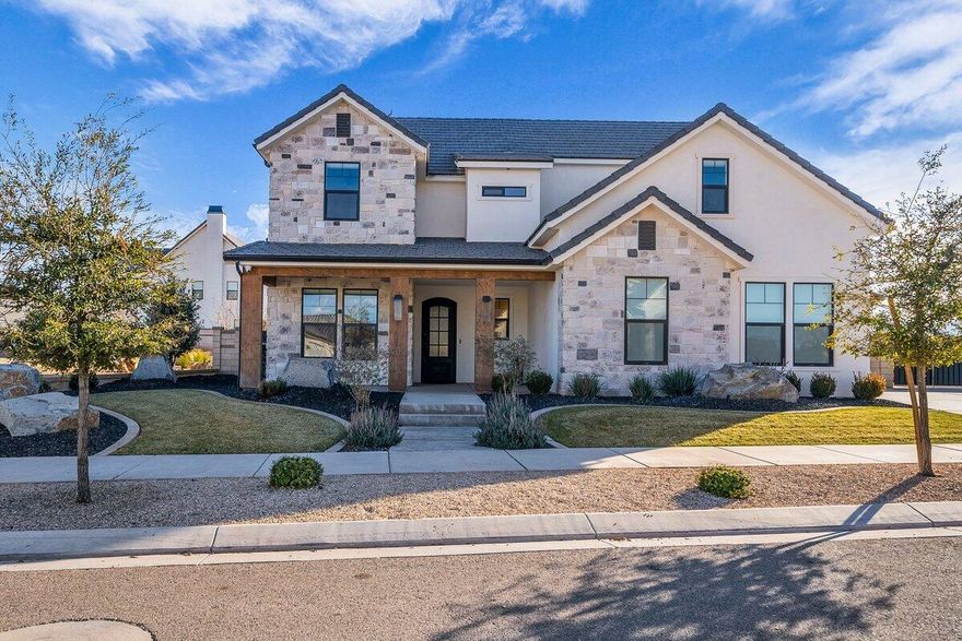 This exceptional corner-lot home is move-in ready, perfectly positioned with open space behind and stunning mountain views. High-end finishes shine throughout with hardwood flooring, custom tile accents, elegant built-ins, a beautiful fireplace, surround sound, and smart Lutron automation with dimmers and automated blinds. The chef's kitchen is designed to impress with a butler's pantry, ample cabinetry, and premium details. The expansive main-floor primary suite is a true retreat, featuring an incredible walk-in shower, relaxing soaker tub, and an oversized walk-in closet. A dedicated main-floor office provides the perfect space for working from home or a private study. Large closets, a bonus room, and abundant storage throughout the home add to the thoughtful and functional design. Step outside to an entertainer's dream backyard with a spacious covered patio, cooling mist system, water feature, built-in BBQ, smoker, grilling stations, striking rock exterior accents, outdoor landscape lighting, all set against a breathtaking mountain backdrop. Additional features include fiber internet, built-in Wi-Fi extenders, TVs included, a security system, upgraded central vacuum, and excellent long-term rental potential. The oversized 3-car garage features epoxy floors, extensive storage, and plenty of room for RV parking outside. Located in the highly sought-after Desert Color community, enjoy incredible amenities including the 2.5-acre lagoon, resort-style pool, fiber internet, and easy access to upcoming restaurants, shopping, golf, trails, parks, and more. All furnishings are negotiable. Buyer to verify all information, deemed reliable, however buyer to verify all info including utilities, rental restrictions, and HOA information if applicable.