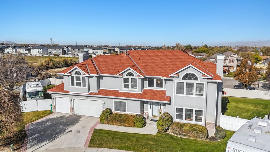 Seller motivated.  This stunning property on a peaceful cul-de-sac offers comfort and versatility on a beautifully landscaped .33 acre lot. With RV parking and a three-car garage, it's tailored for any lifestyle. The main floor boasts a formal living and dining room, a serene office/den, a great room with vaulted ceilings, two fireplaces, a bedroom, a full bathroom, and a gourmet kitchen ideal for entertaining. Upstairs, the owner's suite features a private retreat with a fireplace and entertainment room, plus additional bedrooms with Jack-and-Jill and private baths. The walk-out basement includes a second kitchen, living area, bedroom, bathroom, laundry, and private entrance, perfect as a mother-in-law apartment.