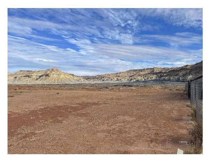 PRICE REDUCED.Discover the perfect canvas for your next venture with this expansive 2.9-acre property located in the growing community of Big Water, Utah. Ideally situated parallel to the highway, this lot offers unmatched visibility and accessibility, making it an excellent choice for a commercial development or any dream project you envision. Utilities are conveniently located on the adjacent lot, streamlining your development process. Big Water is a gateway to some of the region's most stunning attractions. Just 14 miles from the Lake Powell launch at Wahweap, AZ, and 57 miles from Kanab, UT, this property is surrounded by world-renowned destinations, offering limitless potential for tourism-driven ventures. With breathtaking sandy landscapes and incredible outdoor experiences in every direction, this property promises both opportunity and inspiration. Don't miss the chance to make your mark in this dynamic and growing area.