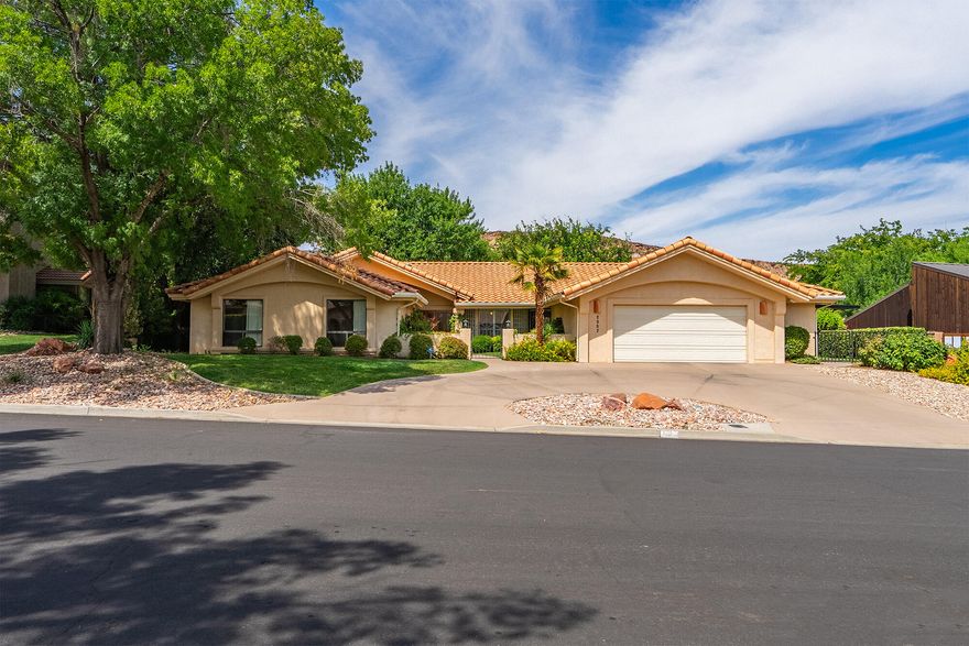 Welcome Home to Bloomington Country Club Living! Located next to the Bloomington Golf Course, this spacious 4-bedroom home combines comfort, function, and timeless style. Step inside to find an upgraded kitchen featuring granite countertops, a skylight for natural light, built-in oven and microwave, and a convenient cooktop. The kitchen and dining area showcase natural hardwood flooring, a bay window, and plantation shutters. Adjacent to the kitchen, the den/family room offers a cozy brick fireplace, guest half bathroom, and access to the covered patio. The inviting living room features patio doors accented with plantation shutters, opening to a formal dining area that's perfect for entertaining. Step out to your wrap around patio to enjoy a functional workshop and garden shed. The generous primary suite features a large picture window, walk-in closet, and ensuite bathroom. Solar tubes throughout the home bring in additional natural light. Enjoy outdoor living on the covered patio, complete with a garden shed and separate workshop. With beautiful landscaping and a highly desirable location near golf, dining, and recreation, this home offers the perfect blend of lifestyle and convenience.