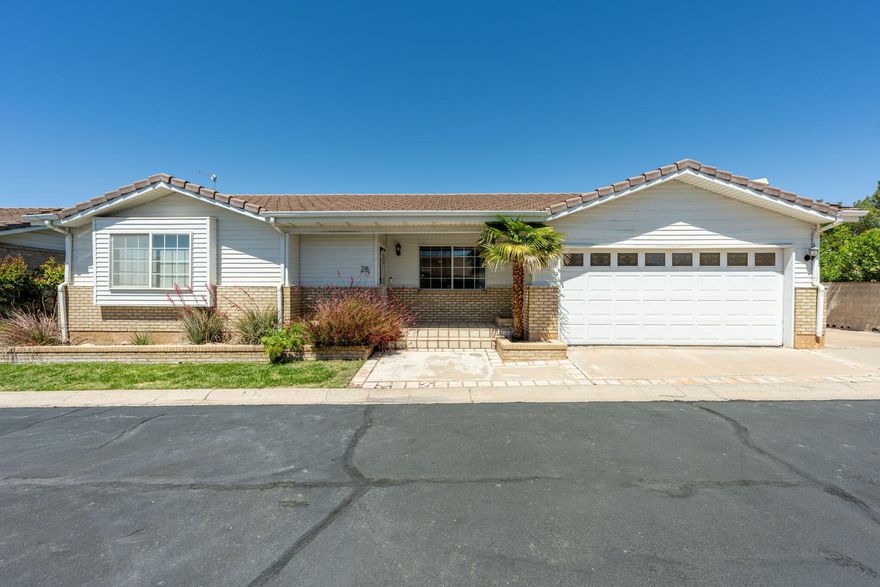 Beautifully maintained single-family home in Heritage Lane, a quiet St. George community! This inviting property features a spacious open living area with abundant natural light, a cozy fireplace, and a seamless flow into the kitchen and dining space. The kitchen offers ample cabinetry, granite countertops, a pantry, bar seating, and desk space. The home's main level includes a primary en-suite and a second bedroom, while the partial basement offers a third bedroom and flexible bonus space ideal for a game room, office, or additional living area. Enjoy the spacious and private covered patio, along with a 2-car garage and RV parking on the side. Conveniently located in downtown St. George near elementary schools, Cox Park, sports courts and more. A great opportunity for low-maintenance living in a well-established neighborhood!