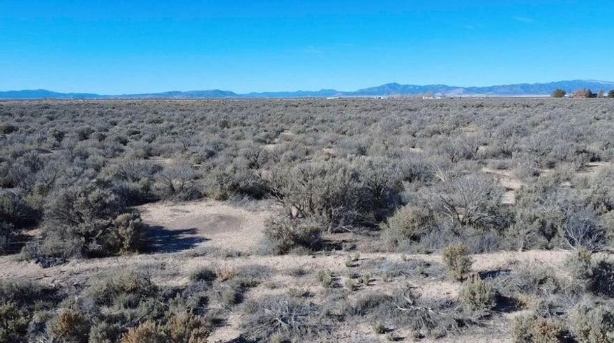 This is the perfect residential rural lot in Beryl, UT for building a home, family vacation retreat, hunting retreat, or preperation retreat. Lot comes with good usable water right .5 Acre Feet of Water Right (#New Water Right Number #71-5981 and #71-5982 1944 Priority Date). Segregation and Change Application completed and well permit has been issued. Land is flat with sage brush and is not sandy. Bring your horses. Easy access to the property from well maintained county roads for year round access. Beautiful unobstructed views of the entire valley and very quiet. Nearest Dixie Power pole is right across the street. Fiber optic internet is available in the street. Owner/Agent