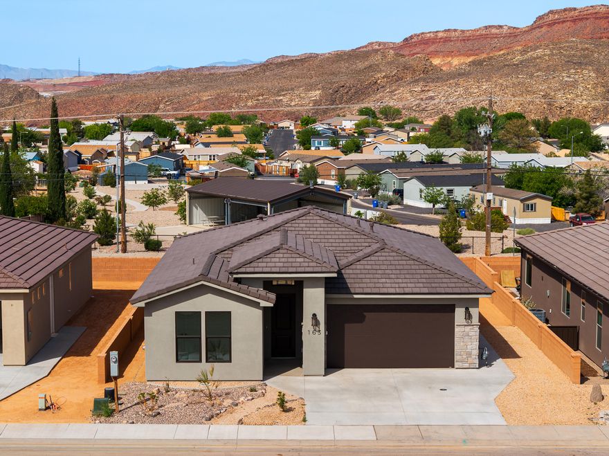 Spectacular Views set the tone from the moment you arrive--wake up to glowing desert skies and unwind with breathtaking Southern Utah sunsets from your own backyard. Brand new construction in the limited and coveted Builder's Reserve--the final phase of Zions Gate Estates--offers a rare opportunity to own one of the community's premier view lots. Tucked in a quiet neighborhood near shopping and dining, you're also minutes from Grandpa's Pond, a local favorite for fishing and outdoor time. Inside, tile flooring and upgraded cabinetry elevate the home beyond typical production builds, while the fully fenced yard offers privacy and space to relax. This is more than a home--it's your Southern Utah retreat.