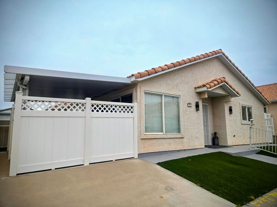 Come see this spacious 3 Bed with Den or Gym Room, 2 bath home in a desirable 55+ community! Featuring a large, bright kitchen with plenty of natural light, this home also offers a versatile bonus room with its own outdoor entrance—perfect for a gym, craft room, or guest space. Enjoy the private covered patio, RV parking with hookups, and low-maintenance artificial turf. Added upgrades include NEW AC unit with warranty, epoxy garage flooring with built-in shelving, and storm doors. Fridge, washer, and dryer are included! With a low HOA and convenient location just minutes from local stores, hospital, and the interstate, this home combines comfort, function, and value.