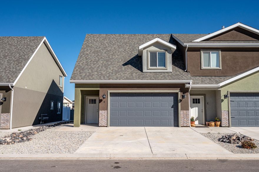 Built in 2023, this two-story townhome offers 1,480 sq ft of well-designed living space. The main level features an open kitchen and living area along with a convenient half bathroom. Upstairs you'll find the primary bedroom with a private full bathroom, three additional rooms that can be used as bedrooms, offices, or flex spaces, and another full bathroom. The functional layout and newer construction make this home a great option for comfortable, low-maintenance living.