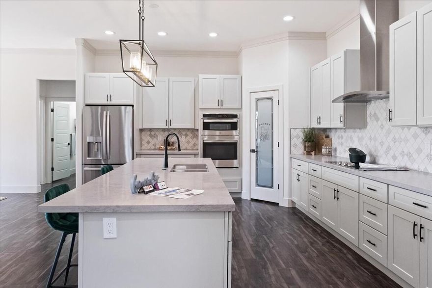 Seller to contribute $20,000 to closing costs. Experience elevated desert living in this stunning 3-bedroom, 2-bath single-family home with a private casita , perfectly situated on a corner lot in North Slope at Copper Rock. Spanning 2,422 sq. ft., this modern masterpiece blends luxury, functionality, and the serene beauty of Southern Utah's landscape.

Step inside to find a bright, open-concept floor plan featuring a gourmet kitchen with premium appliances, custom cabinetry, and a spacious island that's perfect for entertaining. The living area flows effortlessly to the outdoor space, creating a seamless indoor-outdoor lifestyle.

The primary suite offers a peaceful retreat with spa-inspired finishes, while two additional bedrooms provide comfort and flexibility. The attached casita, complete with its own bedroom, kitchenette, and Jack & Jill bath, is ideal for guests, extended family, or rental income potential.

Enjoy the fully fenced and gated backyard, showcasing low-maintenance desert landscaping and a pool-sized yardready for your dream outdoor oasis. A 3-car garage provides ample space for vehicles, toys, and storage.

Located just minutes from world-class golf, hiking, and the breathtaking scenery of Copper Rock, this home delivers modern design and the relaxed charm of desert living.