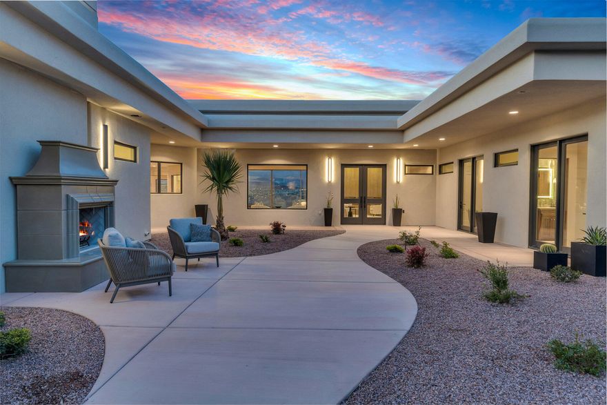 Step into unparalleled luxury with this completely remodeled masterpiece, offering breathtaking unobstructed views and exquisite high-end finishes throughout. This stunning former Parade Home seamlessly blends modern elegance with impeccable craftsmanship. Boasting an open-concept design, this home has been thoughtfully updated to the highest standards, ensuring both beauty and functionality.

The gourmet kitchen is a chef's dream, featuring Subzero and Wolf appliances, Subzero wine fridge, pebble ice machine, new cold drawers, perfect for preparing meals for family or entertaining guests. Gorgeous hardwood flooring throughout the home adds warmth & sophistication, while large windows provide unobstructed panoramic views of the infinity edge pool, Pine Valley mountain & and city light