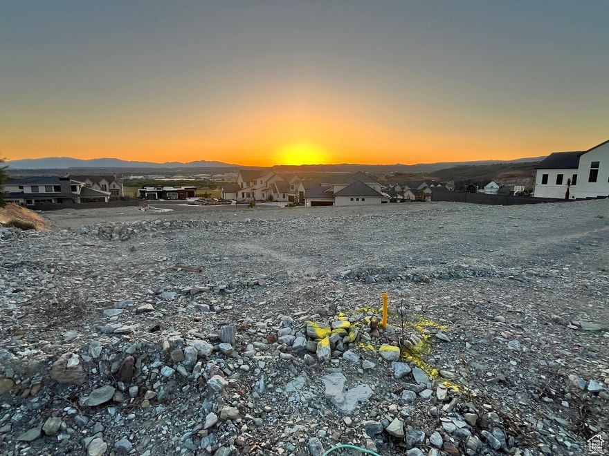 Spectacular views for you to envision and build your dream home on. Imagine enjoying poolside views and entertaining from high up on the hillside. Lot has preliminary grading and utilities are stubbed. You will be surrounded by beautiful quality homes, Next door is a 2025 Parade of Homes home. .57 acre lot to accommadate your plans. Well positioned to provide glorious sunset views across the valley. Survey pins to be found in the front sidewalk so you can measure and plan your dream home layout.