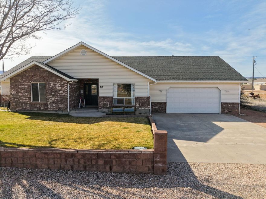 Welcome Home to Small-Town Living at Its Best!
Nestled in the heart of charming Enterprise, Utah, this well-appointed single-story home offers the ease and comfort of one-level living with room for the whole family. Featuring 4 bedrooms, 2 full bathrooms, and a 2-car garage, this home delivers the perfect combination of space, function, and value.
The open single-floor layout makes everyday living a breeze -- no stairs, no hassle, just a thoughtfully designed home that works for families of all stages. The 2-car garage provides ample room for vehicles, storage, or a workshop setup.
Situated in the peaceful community of Enterprise, you're just a short drive from Enterprise Reservoir, Pine Valley recreation areas, and the wide-open beauty of Washington County's outdoors -- whether that's fishing, hiking, ATV trails, or simply soaking in the stunning southern Utah scenery.
Small-town charm, big-sky views, and a home that checks all the boxes -- this is the one you've been waiting for.