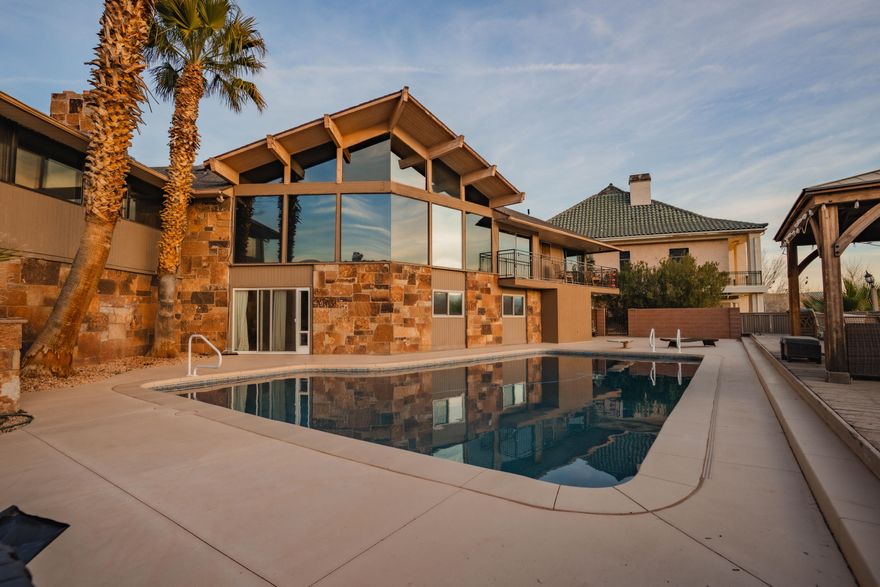 Homes like this only come available once every few decades! Exceptional nearly 0.5-acre estate located in coveted Bloomington. This custom-designed home showcases unique architecture and thoughtful craftsmanship throughout. Perfectly positioned on a private cul-de-sac and backing the scenic Bloomington Country Club Golf Course and pond, the property offers incredible views and a serene setting.

Featuring 5,148 sq ft, this entertainer's dream includes a large, oversized private pool and expansive outdoor space ideal for gatherings. The home has undergone extensive recent updates and remodeling, blending modern comforts with timeless design. Rare nearly half-acre lot in one of the area's most sought-after neighborhoods.