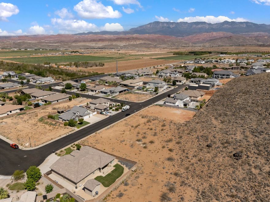 Build your dream home on this spacious .26-acre lot in the highly sought-after Dixie Springs subdivision in Hurricane, Utah. With no HOA and the freedom to bring your own builder, you can design a custom home that fits your lifestyle. Whether that includes an RV garage for all your toys or a peaceful retreat to unwind. Backing to a natural hillside with no backyard neighbors, this lot offers added privacy and a serene setting. Located just minutes from Sand Hollow Reservoir, Sand Mountain dunes, and Dixie Springs Park, you'll enjoy year-round access to boating, off-roading, hiking, and pickleball. Plus, with direct SXS access from your garage to world-class trails, adventure starts right at your doorstep.
Enjoy its close proximity to Zion National Park, top-rated golf courses, and stunning red rock views.
Utilities are stubbed, water fees are paid, and this lot is ready for you to build, invest, and enjoy everything Southern Utah has to offer. Don't miss this rare opportunity!