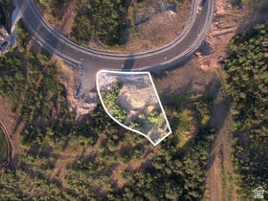 Lot #219 is a premium, gated cul-de-sac homesite offering exceptional privacy, security, and breathtaking views. This expansive lot has breathtaking valley views as well as mountain views. Nestled at the base of the Wasatch Range, Summit Creek is a private, master-planned community designed for those seeking natural beauty, luxury, and a strong sense of connection. Residents enjoy first-class amenities including a modern clubhouse, pickleball courts, state-of-the-art fitness center, resort-style pools, a hot tub, and miles of scenic trails for hiking and biking. Surrounded by custom luxury homes and stunning landscapes, this is the perfect setting to bring your dream home to life.