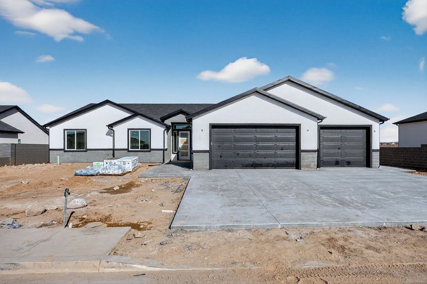 Discover the perfect blend of modern luxury and thoughtful design in this new construction single-level home, offering 2,532 sqft of living space and 3 car garage. With 4 large bedrooms and 2.5 bathrooms, this home sits on a generous .33-acre lot that will be fully fenced with a block wall! The heart of the home is the gourmet kitchen with custom cabinets, tile backsplash, micro hood, huge walk-in working pantry, and a massive island complete with a stylish farmhouse sink. A tray ceiling adds elegance while the generous dining area flows out to a large covered patio-ideal for indoor-outdoor entertaining. The beamed living room features a fireplace accented with shiplap and brick flanked by built-in bookshelves and cabinets. The huge primary bedroom features a tiled shower and soaker tub!