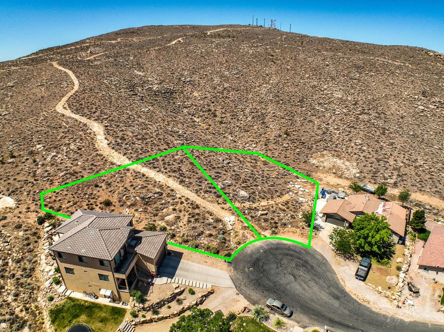 Backed up to the hill, this large double lot in Bloomington Hills is at the end of the Cul-De-Sac. Unbelievable 180 degree views of the city and Pine Valley Mountain.