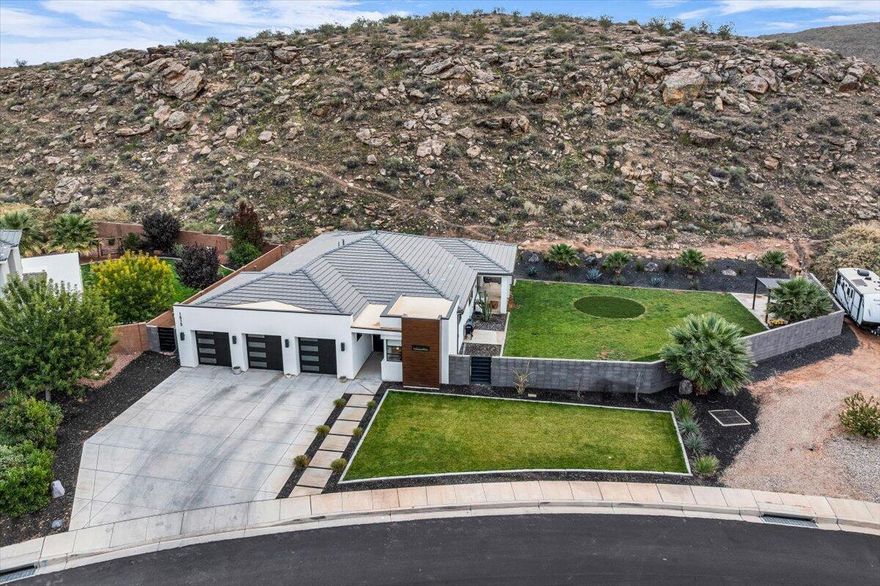 Experience the epitome of modern living in this sleek and contemporary home, situated on a 1.10 acre lot with no neighbors behind. Enjoy the open living room, complete with a fireplace. The stunning kitchen is a culinary haven boasting a large waterfall island, quartz countertops, wall oven and spacious pantry. The fourth bedroom includes a kitchenette perfect for a casita or in law space. The luxurious primary bath is a spa like retreat with a large soaking tub, walk in shower and double sinks. The fully landscaped and fenced backyard is an outdoor oasis, complete with a firepit. The 3 car garage offers ample parking and storage as well as a car lift, a true luxury for any car enthusiast. This remarkable property offers an unparalleled living experience!