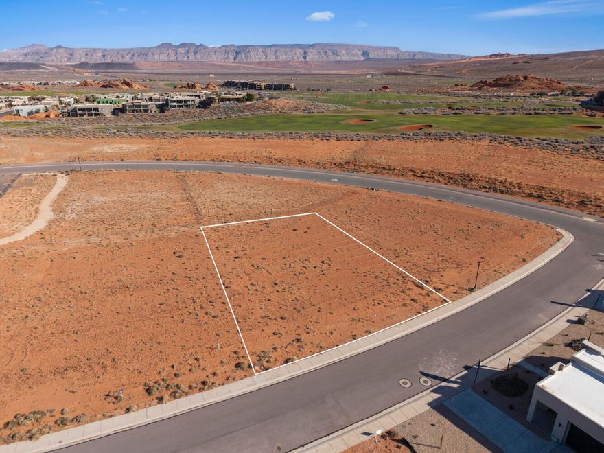 Build your ideal retreat on this .44-acre homesite in The Estates at Sand Hollow Resort, a premier golf course community anchored by a nationally ranked championship course. Surrounded by multi-million-dollar custom residences, this lot offers exceptional privacy and an ideal setting for a luxury home.
The generous lot size allows for expansive outdoor living, a private pool, and oversized garages, perfectly balancing refined living with Southern Utah's adventure-driven lifestyle. Enjoy striking desert landscapes, close proximity to championship golf, and effortless access to world-class recreation. Just minutes from Sand Hollow State Park and the iconic sand dunes, the location delivers seamless access to both resort living and year-round adventure.
Conveniently located 15 minutes from the airport and 1.5 hours from Las Vegas, this homesite is ideal for a luxury primary residence or second home. Ownership includes valuable homeowner benefits, such as front and backyard landscape maintenance for low-maintenance living. You may choose from a list of Premier Builders or bring your own developer-approved builder to bring your vision to life.