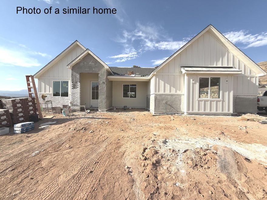 **To Be Built** or Bring Your Own Plan. Featuring all of the latest innovations and upgrades you're sure to love. The views are amazing and there is plenty of room to add a pool, workshop, RV garage or all of the above on this huge .41 acre lot. Priced right to be able to live comfortably and spread out in a great neighborhood where the houses aren't on top of each other, this is a home you will want to see in person! Views of Copper Rock golf course and easy access to the new SR-7 by way, you are just a short, quick drive to anywhere in the area. Ride your side-by-side from your home to public land that is just down the street. Enjoy all that Southern Utah has to offer. Not zoned for nightly rentals.