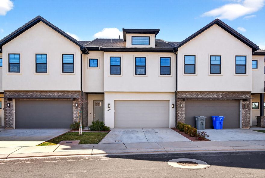 Sought after Ocotillo Springs townhome featuring 3 bed, 3.5 bath offered fully furnished and approved for overnight rentals. Each bedroom features a private en-suite bath, ideal for guests. Open-concept living opens to a private hot tub, patio, and deck with beautiful views. This property is an established short-term rental and is marketed alongside a companion property, allowing for larger group bookings and increased revenue potential. Ocotillo Springs offers resort-style amenities including a pool with jump rock, water slide, splash pad, and pickleball courts. Located minutes from Snow Canyon State Park, Tuacahn Center for the Arts, and hiking and biking trails. Ideal as a turnkey investment, vacation home, or lock-and-leave Southern Utah retreat.