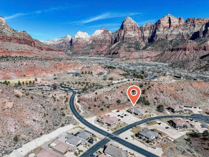 PRICE IMPROVEMENT!! Your Zion Retreat awaits!! Extremely rare opportunity to own, one, two, three or four beautiful, like new condominiums just 1/2 mile from Zion National Park! This is one of four condos in a four plex. All four are available to purchase individually. ALL furnishings & Appliances INCLUDED! Excellent investment opportunity! Live in one... rent three!
Located in the tranquil Moenave community, in the heart of Springdale, Utah, this home offers stunning, unobstructed 360 degree towering red rock views. With expansive windows and 9' ceilings natural light fills the home, ensuring you're surrounded by breathtaking scenery from every room. The thoughtfully designed floor plan provides an inviting and spacious living area. The kitchen features a large island, granite countertops, subway tile backsplash, and custom cabinetry with crown molding, glass accents, and under-cabinet lighting. Stainless steel appliances, including a gas (propane) range and side-by-side refrigerator with water and ice dispenser, complete the space.
Luxury vinyl flooring flows throughout the main living areas, complemented by recessed lighting. Bathrooms feature tile flooring, tile shower surrounds with glass doors, and granite countertops, adding to the home's refined design.
The covered patio off the dining area creates a charming outdoor living space with a backdrop of the stunning red rock towering all around. You simply can not beat the peaceful beauty that is Moenave.
Built high-quality, energy-efficient features, including 2x6 exterior walls, blown-in insulation (R50 attic / R23-25 walls), Low-E windows, a 95+% efficient furnace, and a tankless water heater, this home offers both comfort and sustainability.
Located at the heart of Springdale, and in walking distance from its shops and restaurants with an abundance of stunning hiking and biking option, this home is the perfect blend of luxury, convenience, and breathtaking, natural beauty. Everything you dreamed your Zion Retreat would be, and more!
Springdale does not allow overnight rentals. Long term rentals are allowed at a minimum of 60 days. Photo Note* There are a few photos labeled as being of Unit B. All other interior photos are of Unit C, which has a different interior color palette, but is the exact same layout as Unit B. All information provided as a courtesy. Buyer to verify all.