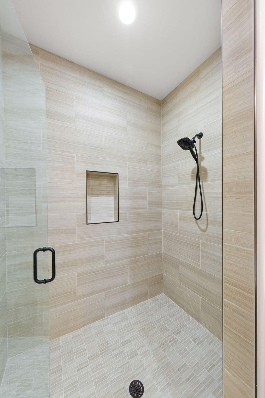 Huge 60' RV garage plus addt'l covered RV parking w/painted epoxy garage floors. Home loaded w/high-end appliances, central vac, hot water recirculating system, propane cooktop w/electric oven. RV garage has RV dump w/faucet close by. Addt'l 57' covered outside parking for extra toy space. Granite countertops throughout, 5' jetted tub, electric fireplace, plantation shutters throughout home.