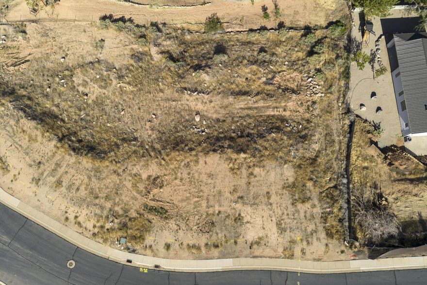 Large .44 acre lot, conveniently located in La Verkin just minutes from Zion National Park. Offering walk-out basement potential, this affordable building lot provides the perfect opportunity to build in Southern Utah without the burden of HOA fees. Tucked into a relaxed neighborhood, you will enjoy sweeping views of the valley and surrounding red rock mesas without paying premium resort prices.