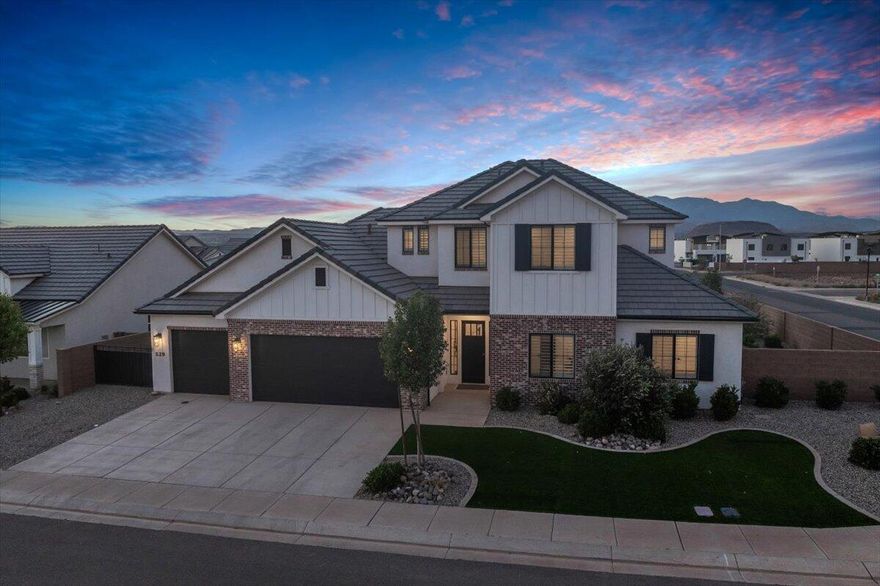 Gently used as a second home and carefully maintained, this 2021 New Trends build is truly move-in ready. The floor plan includes two spacious living areas, tall ceilings, custom cabinetry, quartz countertops, a butler's pantry, and quality appliances that complement the home's finish. The backyard is complete with a pool and spa, a putting green, and low-maintenance artificial turf. This home sits near Crimson Cliffs High, the Red Cliffs LDS Temple, and is close to shopping, dining, and everything you need nearby.