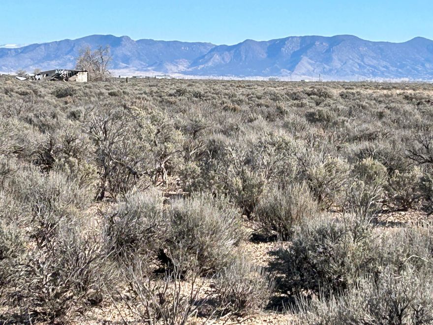 Nice level lot located 6 mi. NW of Beryl Junction with beautiful mountain views. Lot comes with 1 AF of Water Right #71-6041 & 71-6042 with Priority Date 1944. Electricity is approximately 600 ft to the east ; telephone box at NE corner; Fiber optic cable (South Central Communications) 600 ft to the east