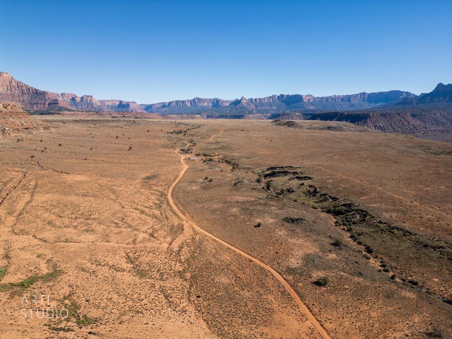 A Once-in-a-Lifetime Opportunity Near Zion National Park

Welcome to 690 acres of pristine, flat, and mostly usable land — a rare canvas of opportunity just 15 minutes from the breathtaking entrance of Zion National Park and a short 45-minute drive to St. George's vibrant downtown, regional airport, and world-class golf and recreation.

Nestled just minutes off State Route 9, this private gem offers 360-degree panoramic views of Utah's red rock majesty, coupled with natural topography that ensures unmatched privacy, peace, and serenity. Whether envisioned as an exclusive retreat, a destination resort, a family ranch or a visionary master-planned community, this land holds limitless potential for those who dream big.

Schedule a private tour: Bring your vision. Build your legacy.

*Irriagtion water rights available. 125 acre-feet of irrigation water available outside of the purchase. Ownership is currently in the process of converting irrigation shares to underground rights.

*Minieral rights available .

**Buyer to verify all claims and information provided, including but not limited to acreage, water and mineral rights.**