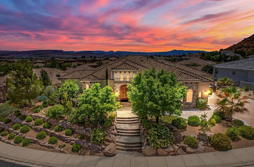 Some homes are simply built differently. Set on an elevated lot in the coveted Northbridge community of Green Springs, this 5,018 sq ft residence was designed for the way people actually live -- beautifully and without compromise. The main level delivers a serene primary retreat, a handsome office with custom built-ins & fireplace, and a gourmet kitchen appointed with cherry cabinetry, granite counters, pot-filler, prep sink & walk-in pantry. Three fireplaces, a wet bar, and a covered deck framed by mature palms set the tone for effortless entertaining. The walk-out lower level -- complete with a second kitchen, theater room & three additional bedrooms -- is ideal for multigenerational living, a private second-home escape, or an exceptional corporate retreat. Contact listing agent to schedule your private showing today. Outdoor Amenities: Heated spool (currently drained) with black pebble and abalone finish. Natural rock waterfall, tropical landscaping, and landscape lighting. Two covered patios, firepit area, raised garden beds, and a 5-hole putting course. Fully automated irrigation system for easy maintenance
Additional Highlights: Two garages (3-car total) with built-ins and attic access, 3rd garage has extra depth. Kenetico water conditioning system with RO, central vac, monitored security system. Three HVAC zones, two water heaters with recirculation pump, and extra insulation throughout. Custom window treatments, plantation shutters, and in-ceiling sound systems with room-by-room volume control. 

Location Perks: Minutes from schools, parks, shopping, and the new Washington Parkway for easy access to I-15. North Bridge Estates is known for its quiet luxury and elevated lifestyle.

A Home Built to Last. With timeless finishes and a layout designed for comfort, this property offers space, serenity, and lasting value. Private showings available now.