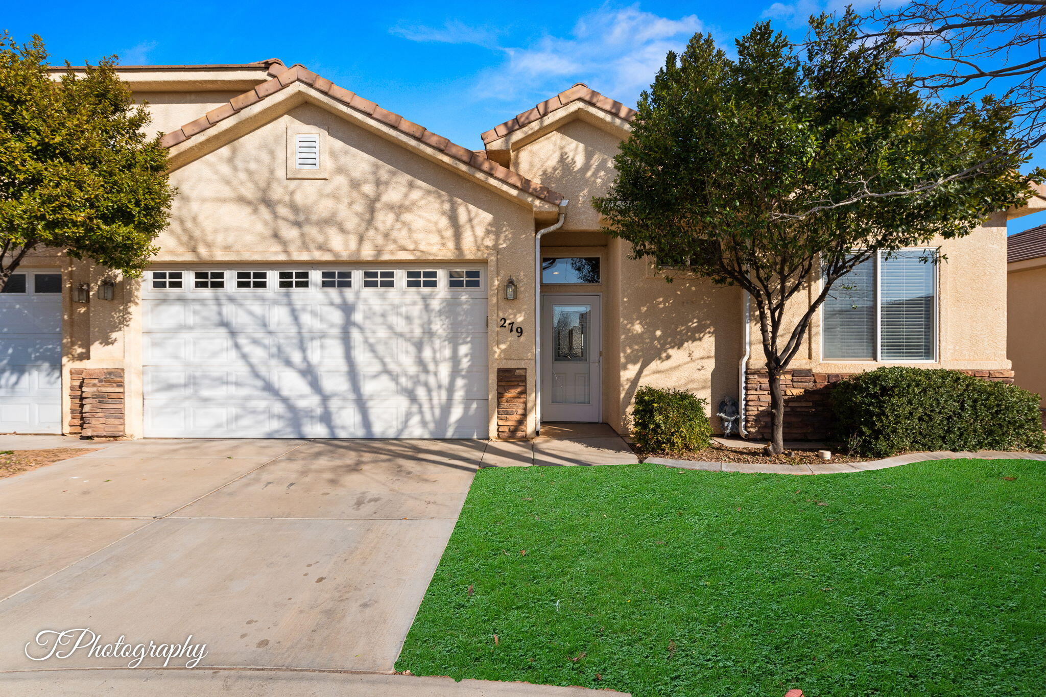 SUPER CLEAN, MOVE-IN READY AND FULLY FURNISHED!!  This townhome in the desireable Sky Ridge TH community boasts 10 ft. ceilings, covered patio, & quiet street location.  Recent upgrades inc. new paint and flooring throughout (1 yr old),  appliances are brand new or newer.  Only minutes to  Sand Hollow recreation area, Zion Nat'l Park, golfing, shopping, dining, medical and more.  **The green on the front and back lawns are for visual purposes only.  Sod for front and back yards to be installed 1st part of February.**