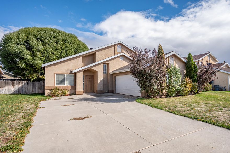 Located on a .16-acre lot, this 1,480-square-foot home features four bedrooms and two full bathrooms. Upon entering, you'll find a dining area connected to the kitchen, which leads to a living room with backyard access. The main floor includes three bedrooms and one full bathroom.
Upstairs, a 440-square-foot master suite offers a walk-in closet and a private bathroom. The backyard is ideal for children, featuring a large shade tree. The garage includes shelving and cabinets for organized storage.
This property offers practical living space, ready for your personal touch. Everything inside will be staying!