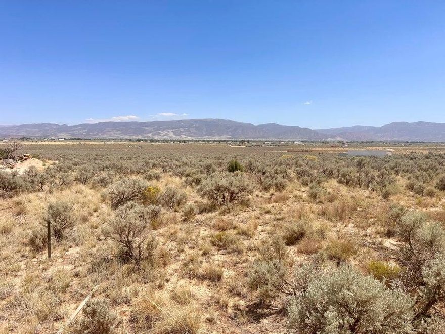 1.25 Acres of Possibility - No HOA, No CC&Rs, No Nonsense! Looking for land where you make the rules? This 1.25-acre lot offers wide-open valley and mountain views with scattered trees nearby, giving you a perfect balance of privacy and scenery. With no CC&Rs and no HOA, you'll have the freedom to build what you want, how you want—without the usual red tape. Property includes 1 AF of water right #73-0504 Whether you're dreaming of a barndominium, a cabin getaway, or a homestead with animals, this parcel puts the power in your hands. The city has limited control out here, meaning more flexibility for off-grid or alternative living.
Located in a quiet area but not far from town conveniences
Well and septic needed
Scenic, peaceful setting with a rural feel and endless views.