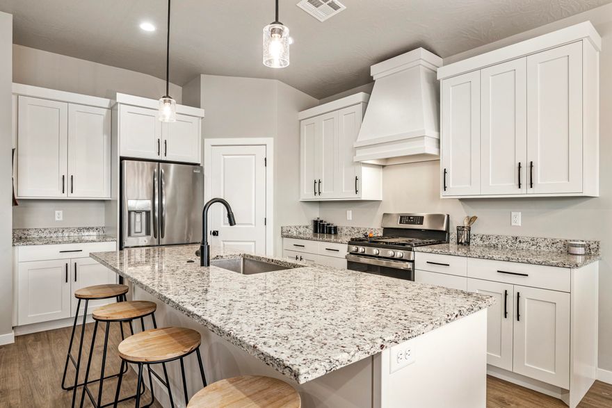 This 3 bedroom 2 bath home offers modern amenities with everyday functionality, boasting high-end finishes throughout.  This home provides an open-concept layout with an emphasis on natural light, including high-quality LVP flooring and contemporary hardware. Modern Kitchen: The heart of the home features an upgraded kitchen. The centerpiece is a stunning custom range hood that complements the sleek cabinetry and stainless steel appliances, making it as beautiful as it is functional.
Spa-Like Primary Suite: Retreat to the primary bathroom, designed as a private sanctuary. Indulge in the deep soaking tub or the walk-in shower, providing a true 'spa at home' experience every single day.
Outdoor Living & RV Ready: The exterior is fully realized with finished landscaping, complete with RV parking and full RV hookups.
No HOA. This 3-bedroom 2-bath home offers modern amenities with everyday functionality, boasting high-end finishes throughout.  This home provides an open-concept layout with an emphasis on natural light, including high-quality LVP flooring and contemporary hardware.

Modern Kitchen: The heart of the home features an upgraded kitchen. The centerpiece is a stunning custom range hood that complements the sleek cabinetry and stainless-steel appliances, making it as beautiful as it is functional.

Spa-Like Primary Suite: Retreat to the primary bathroom, designed as a private sanctuary. Indulge in the deep soaking tub or the walk-in shower, providing a true "spa at home" experience every single day.

Outdoor Living & RV Ready: The exterior is fully realized with finished landscaping, complete with RV parking and full RV hookups.  No HOA.