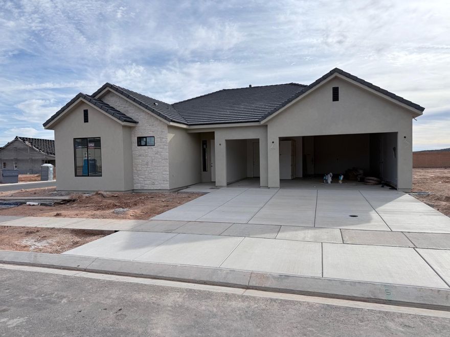 This brand new home will be ready for move in January 2026! This new SunRiver community is just West of Toquerville and will have over 1,200 homes and the amenities and lifestyle that SunRiver is famous for. 1st phase of amenities breaking ground in late 2025 and ready for use late 2026. This home is a Tara spec home with over $102K in design upgrades and comes fully landscaped. No HOA for first 2 years after closing to Founders Club (first 74 homes.) Visit www.sunriver.com to see all the details. Buy now and get larger homesites close to amenity. This home qualifies for HECM purchase, as low as $339,900 down with no mortgage payment if over 62 years old, for qualified borrowers.