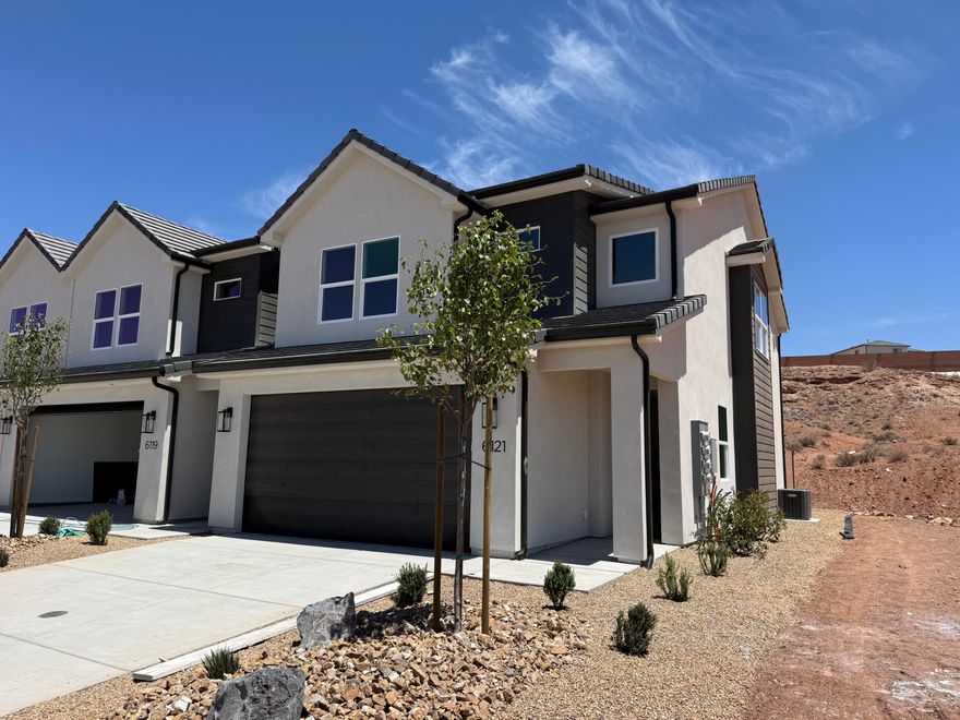 Highly sought after 4-bedroom townhome!  This townhome is anything but typical! Elevated finishes and thoughtful design shine throughout this beautifully appointed home. The open-concept main level offers a spacious living area filled with natural light from oversized windows and an impressive 6080 sliding glass door off the dining room. The gourmet kitchen is designed for both functionality and entertaining, featuring an extra-long island, abundant cabinetry, and convenient pull-out garbage cans built directly into the island. Step outside to enjoy added privacy from the back porch thanks to block wall dividers between units.

Upstairs is situated with 4 bedrooms.  The luxurious primary suite boasts a spa-inspired bathroom complete with high-end finishes, an extra-wide double vanity, and ample cabinet storage. Both the primary and guest bathrooms feature beautifully tiled showers that elevate the home even further. And unlike many townhomes, this rare oversized garage offers extra depth so you can comfortably park a truck inside.

Located in an area experiencing exciting growth, this community offers increasing convenience and future value. Enjoy having the new Maverik gas station just kiddy-corner to the neighborhood, with additional commercial tenants and amenities coming soon. A truly exceptional opportunity combining style, comfort, functionality, and location!

Photos of finished home are for visual assistance only. Actual home may differ in color/finishes. Contact me for more info.